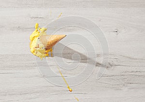 Ice cream in a waffle cone fell on floor