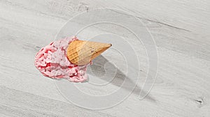 Ice cream in a waffle cone fell on floor