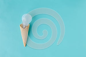 Ice cream waffle cone with light bulb, idea concept