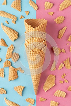 Ice cream waffle cones on pink and blue background