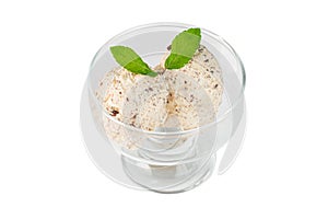Ice cream with walnuts in glass bowl on a white isolated background