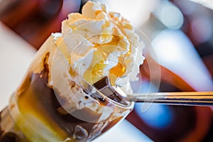 Ice Cream with Whipped cream and Toffee Sauce photo