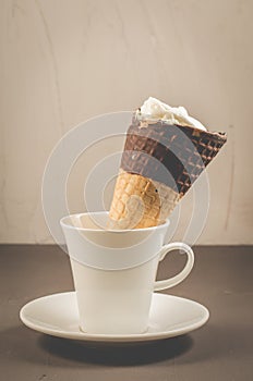 ice cream on a in a white cup/ ice cream with cone in chocolate on a in a white cup, selective focus