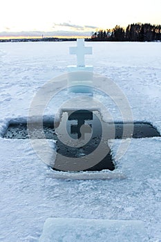 Ice cross hole for the holidays of Orthodox baptism in Russia