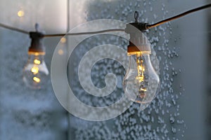 Ice Crystals on a Frozen Glass and a Lamp in Front of Them