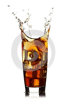 Ice cube droped in cola glass