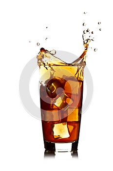 Ice cube droped in cola glass