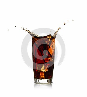 Ice cube droped in cola glass