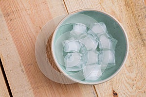 Ice cube with star shape in bowl