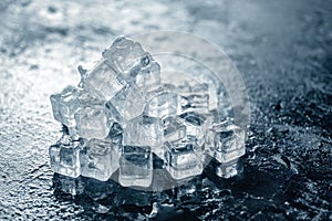 Ice cube on wooden table and light blurred background