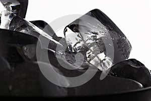 Ice cubes on black background. Low key photo