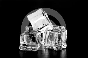 Ice cubes on black table. Selective focus