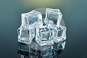 Ice cubes composed of a pyramid on a dark background