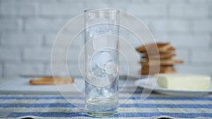 Ice Cubes in an Empty Glass Waiting for Fresh Water for a Chill Drink