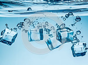 Ice cubes falling under water