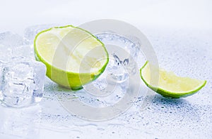 Ice cubes with fresh lime isolated on white