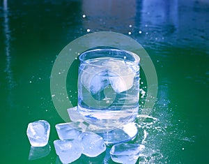 Ice cubes on an iced water surface