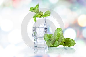 Ice cubes and splashing water with mint