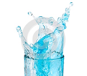 ice cubes threw into a glass of pure water and water splashes