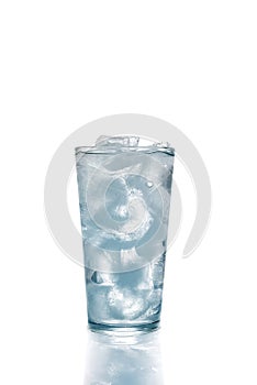 Ice cubes and water in drinking glass