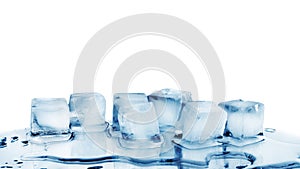Ice cubes on white glass mirror background with reflection isolated close up, transparent frozen and melted crushed blue ice cubes