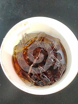 Ice in cup of cola