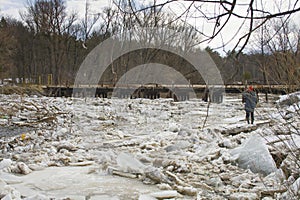 Ice drift on the river, ice accumulation near the bridge