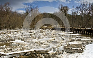 Ice drift on the river, ice accumulation near the bridge