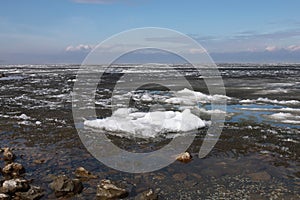 Ice drift on the river. Melting ice on the river has a crystalline structure.