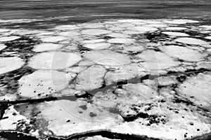 Ice drift in spring on Lake Onega, Karelia. Dangerous thin spring ice in April. Aggregate accumulations of fine