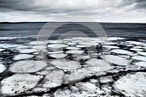 Ice drift in spring on Lake Onega, Karelia. Dangerous thin spring ice in April. Aggregate accumulations of fine