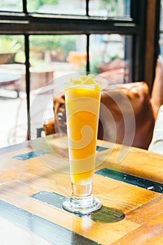 Ice drinking mango smoothie glass