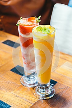 Ice drinking mango smoothie glass