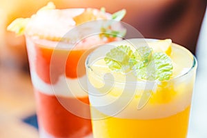 Ice drinking mango smoothie glass