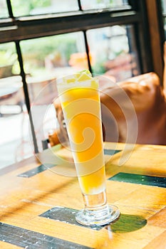 Ice drinking mango smoothie glass