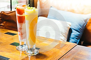 Ice drinking mango smoothie glass