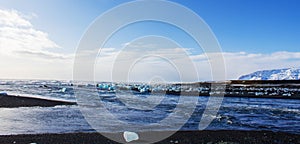 ice fields at the black pebble beach, coast of iceland