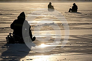Ice fishermen waiting for their catch on frozen lake. Generative AI