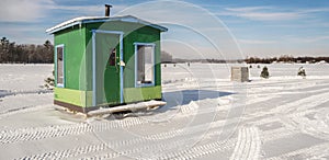 Green and Blue Ice Fishing Cabins in Ste-Rose Laval photo