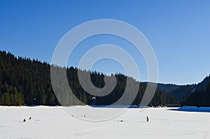 Ice fishing, Rhodope Mountains, Bulgaria