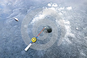 Ice fishing rod with the lure by the hole