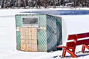 Ice Fishing Shanty covered in Fish Scales