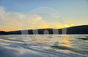 Ice Fishing at Sunset in New England