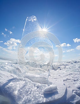 Ice floe and sun on winter Baikal lake