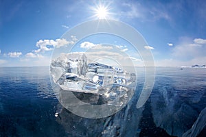 Ice floe and sun on winter Baikal lake