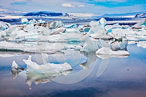 Ice floes are reflected in the water of ocean