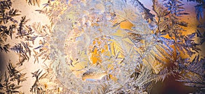 Ice flowers frozen on window. Winter cold textured pattern. Macro view. Frost crystal.