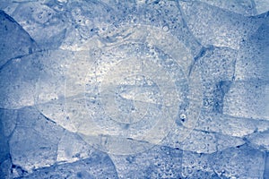 Ice frozen background with cracks on surface, texture