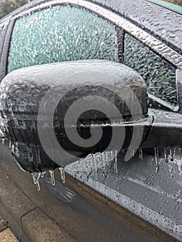 Ice on a frozen car on a cold day