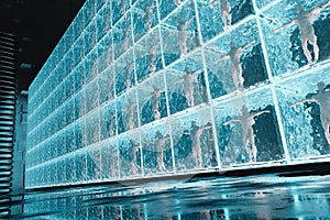 The ice glass cube glows against the dark background of space. 3D Rendering